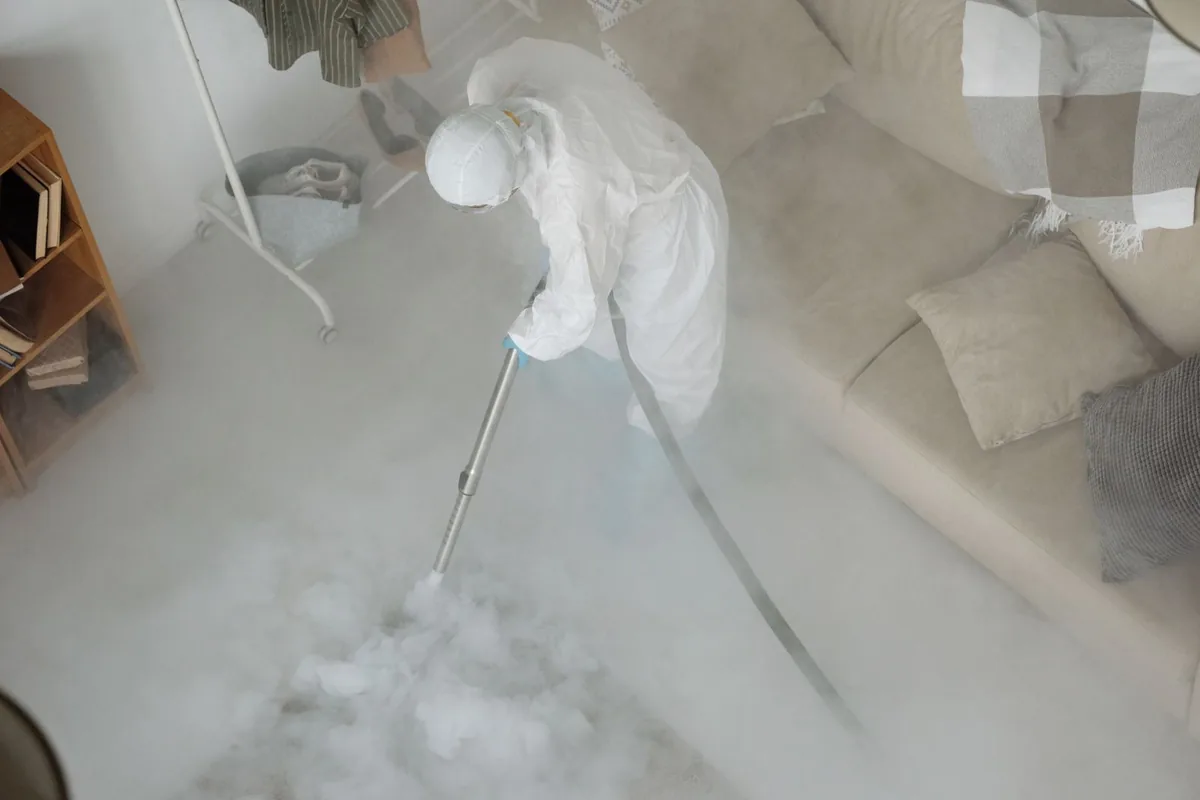 Biohazard cleanup technician in protective equipment, Harbour Heights, FL